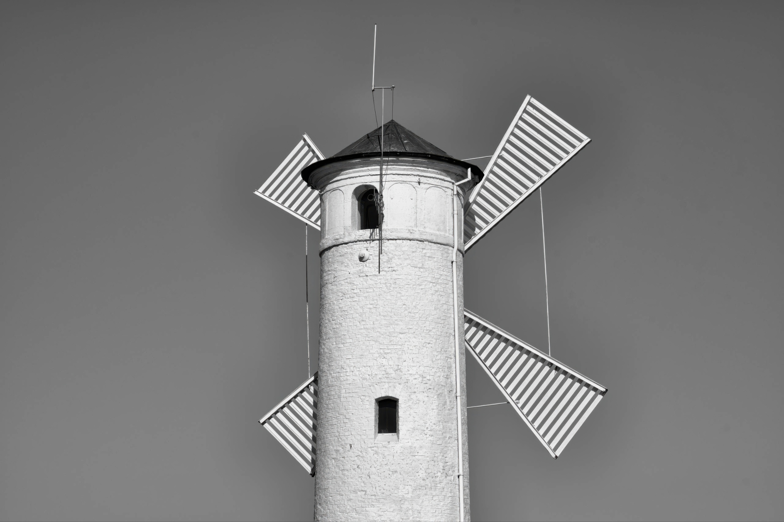 A Solitary Windmill Reaching into the Grey