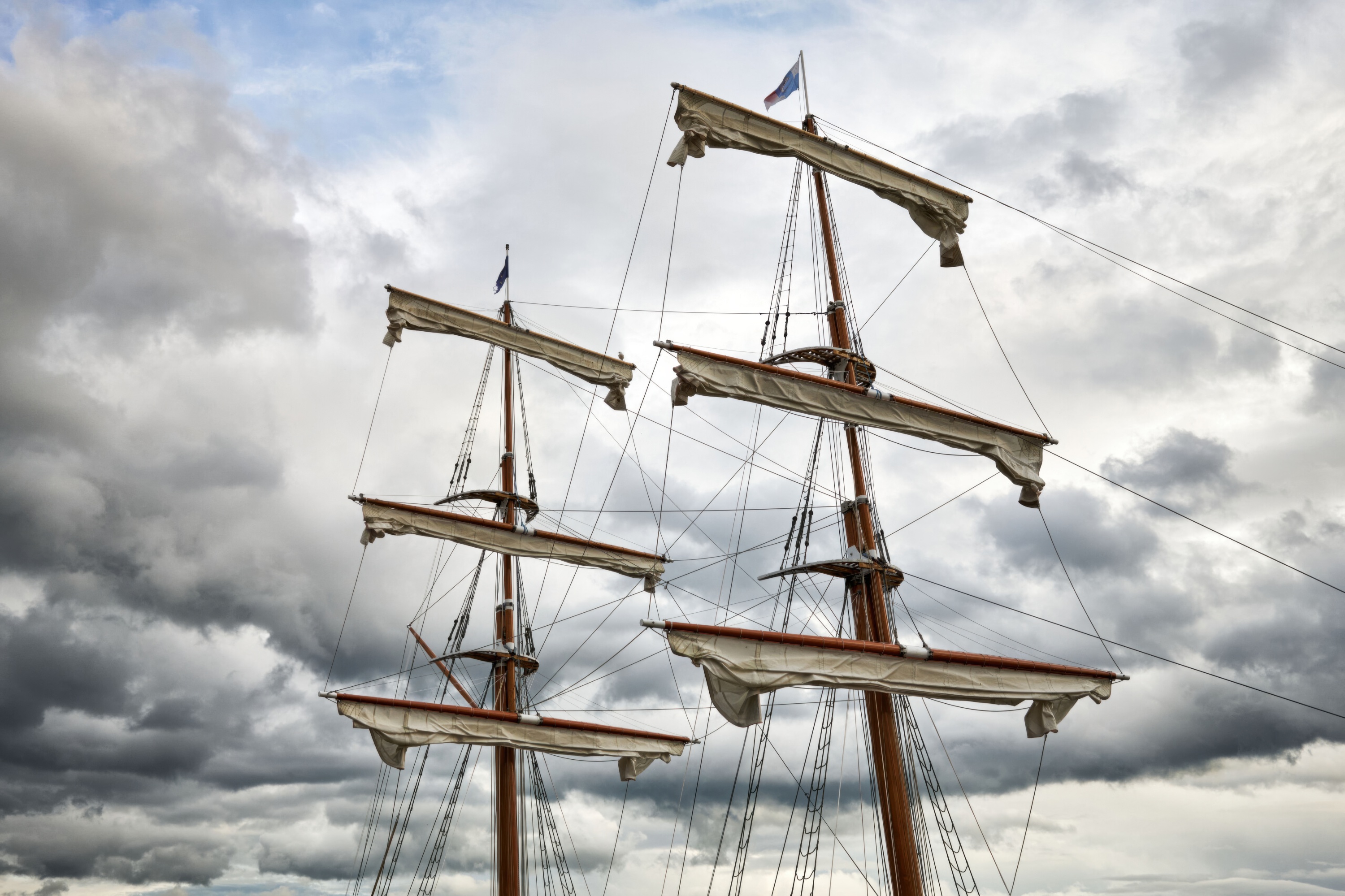 Rigging and Masts Against the Storm Clouds