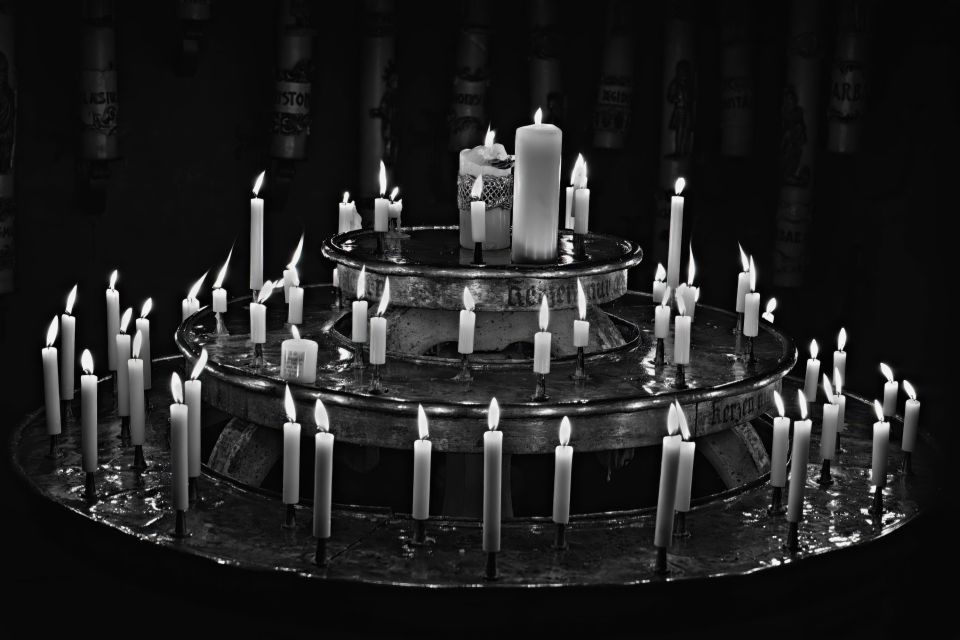 Rows of Candles on a Tiered Offering Stand